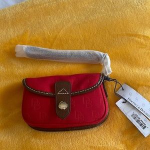 🆕 Dooney and Bourke canvas, monogram wristlet in bright red with leather trim